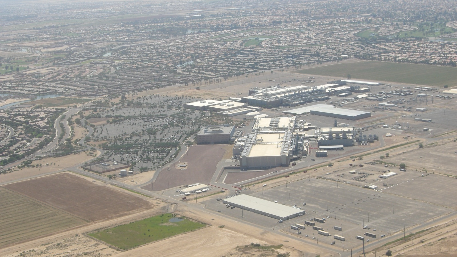 Intel semiconductor fabrication buildings in Arizona under a clear blue sky