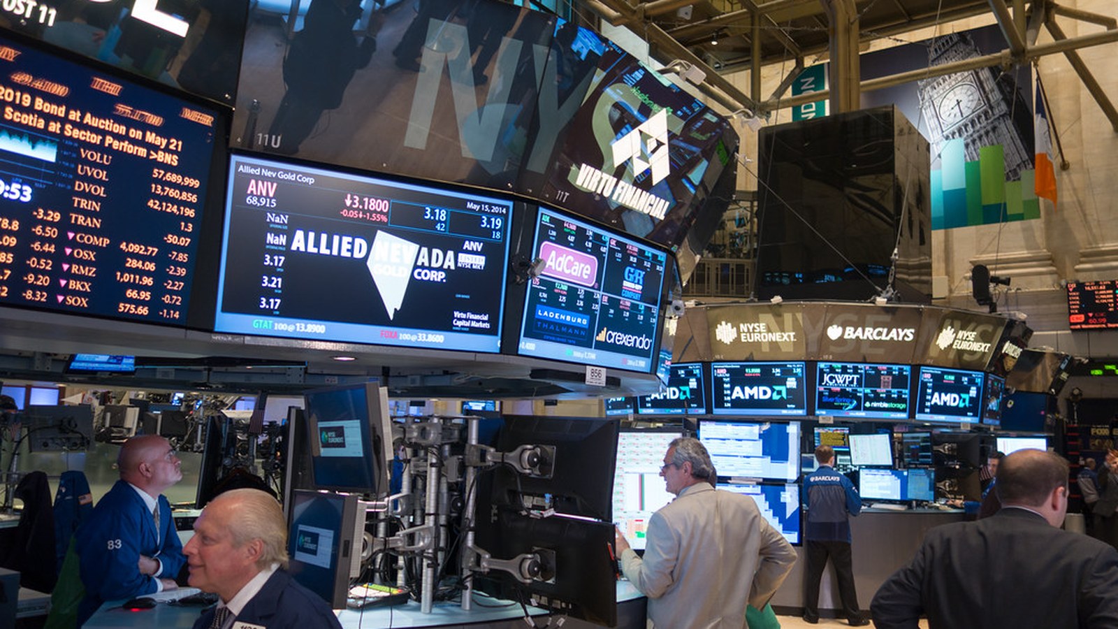 Traders and market screens on the New York Stock Exchange floor