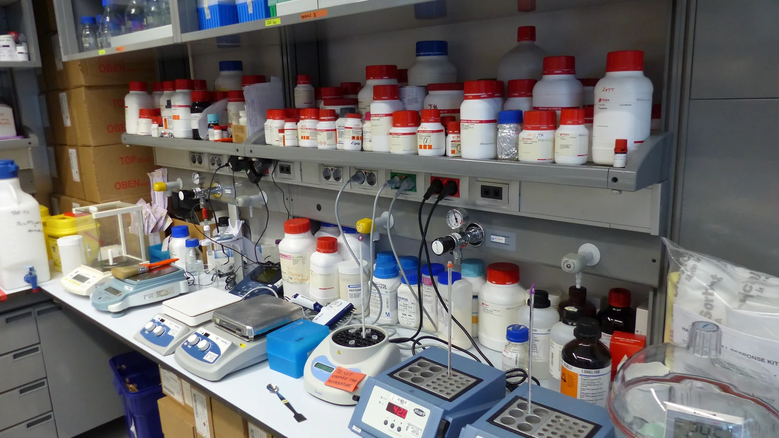 Biomedical research laboratory benches, instruments and reagent shelves at Barcelona Biomedical Research Park