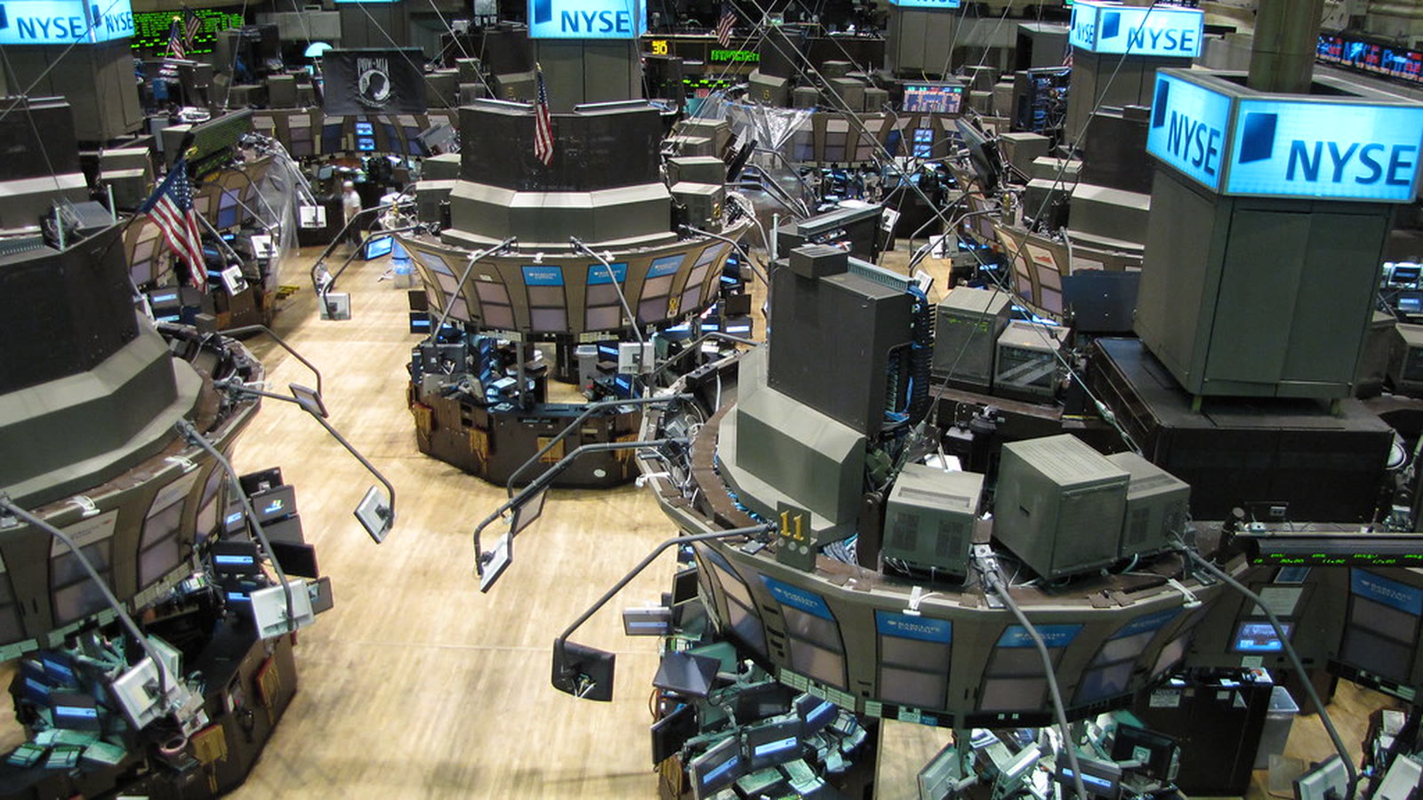 Traders and market screens on the New York Stock Exchange floor