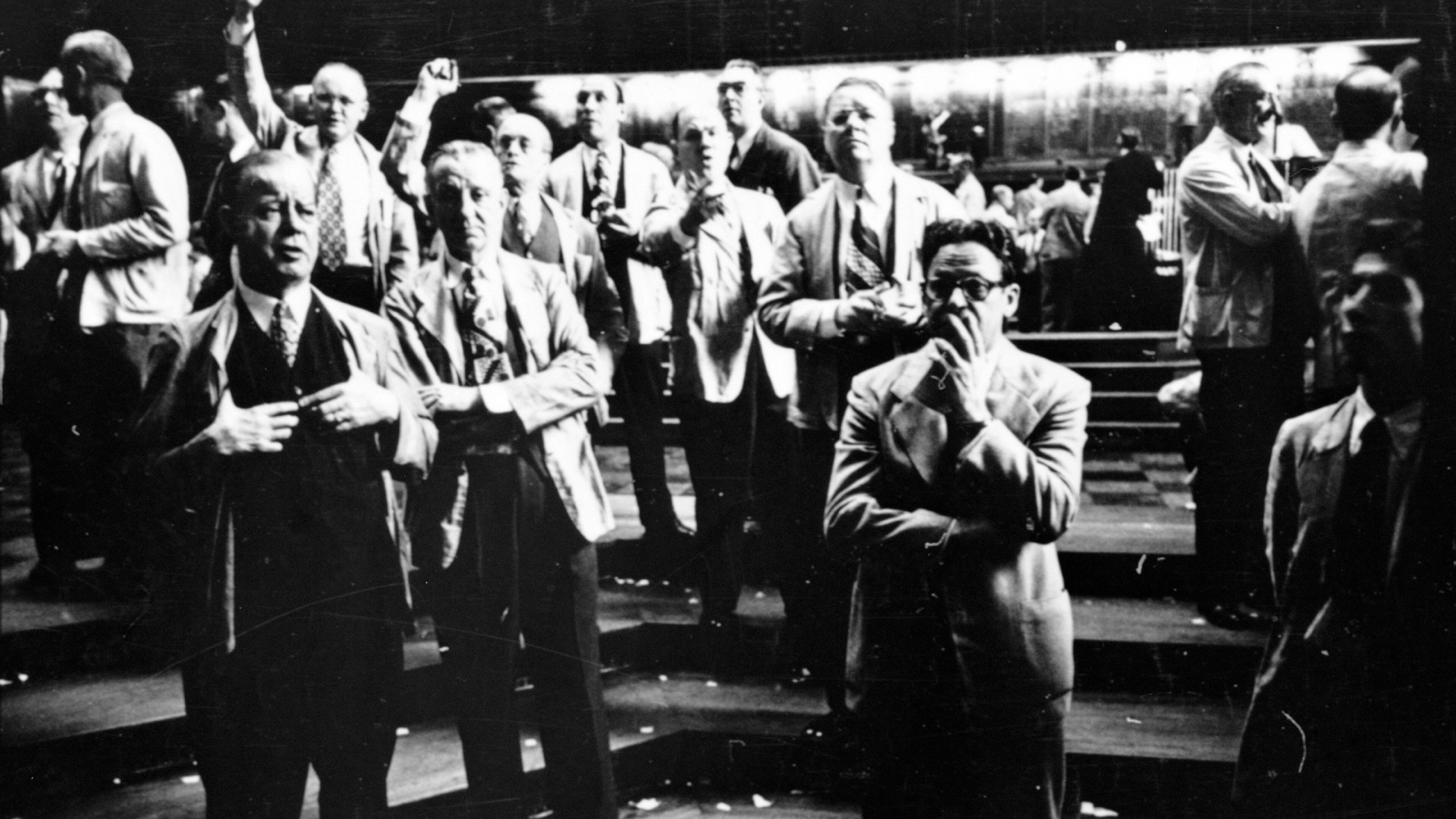 Chicago Board of Trade traders gesture and watch prices on a crowded trading floor in 1949
