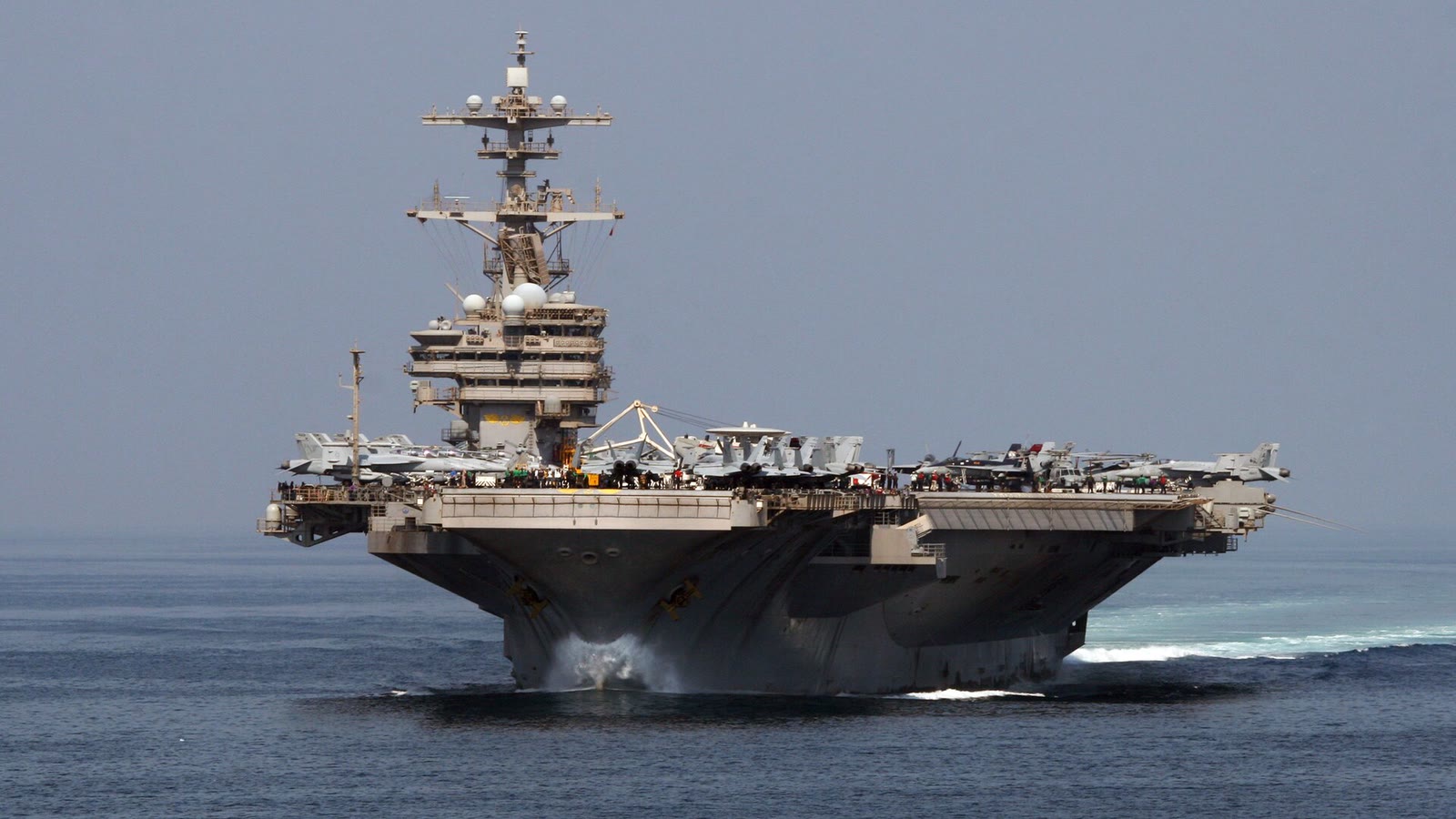USS George H.W. Bush transits the Strait of Hormuz on a clear day