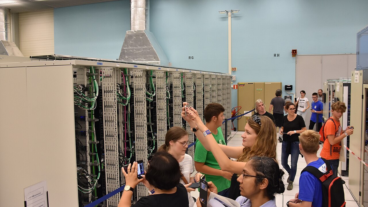 Visitors photograph server racks inside CERN’s computer centre
