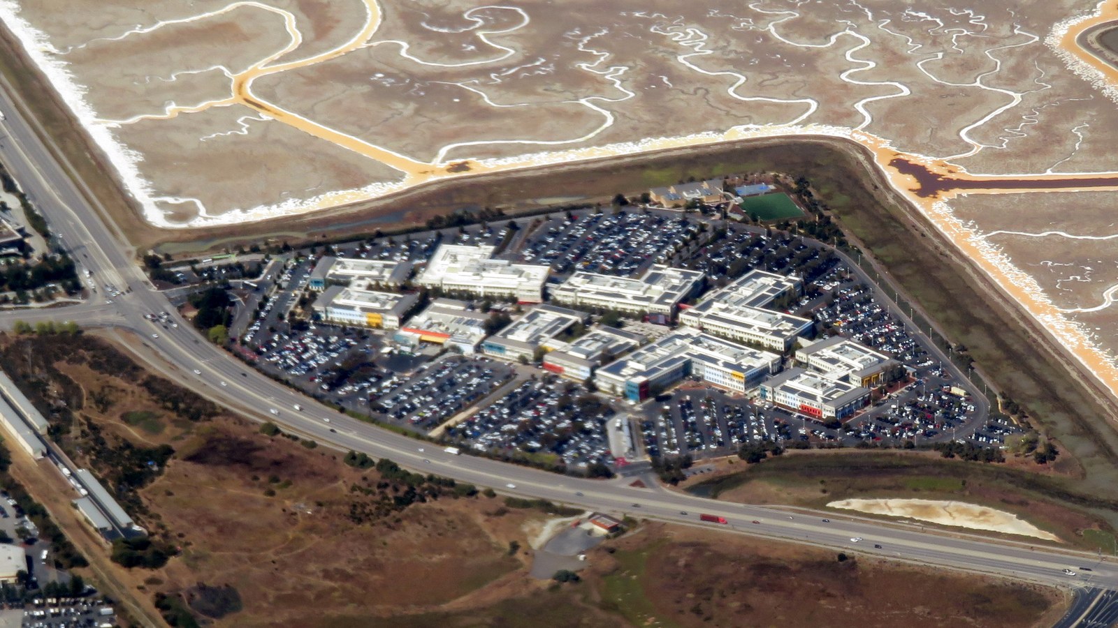 Aerial view of Facebook's Menlo Park campus beside marshlands in September 2019