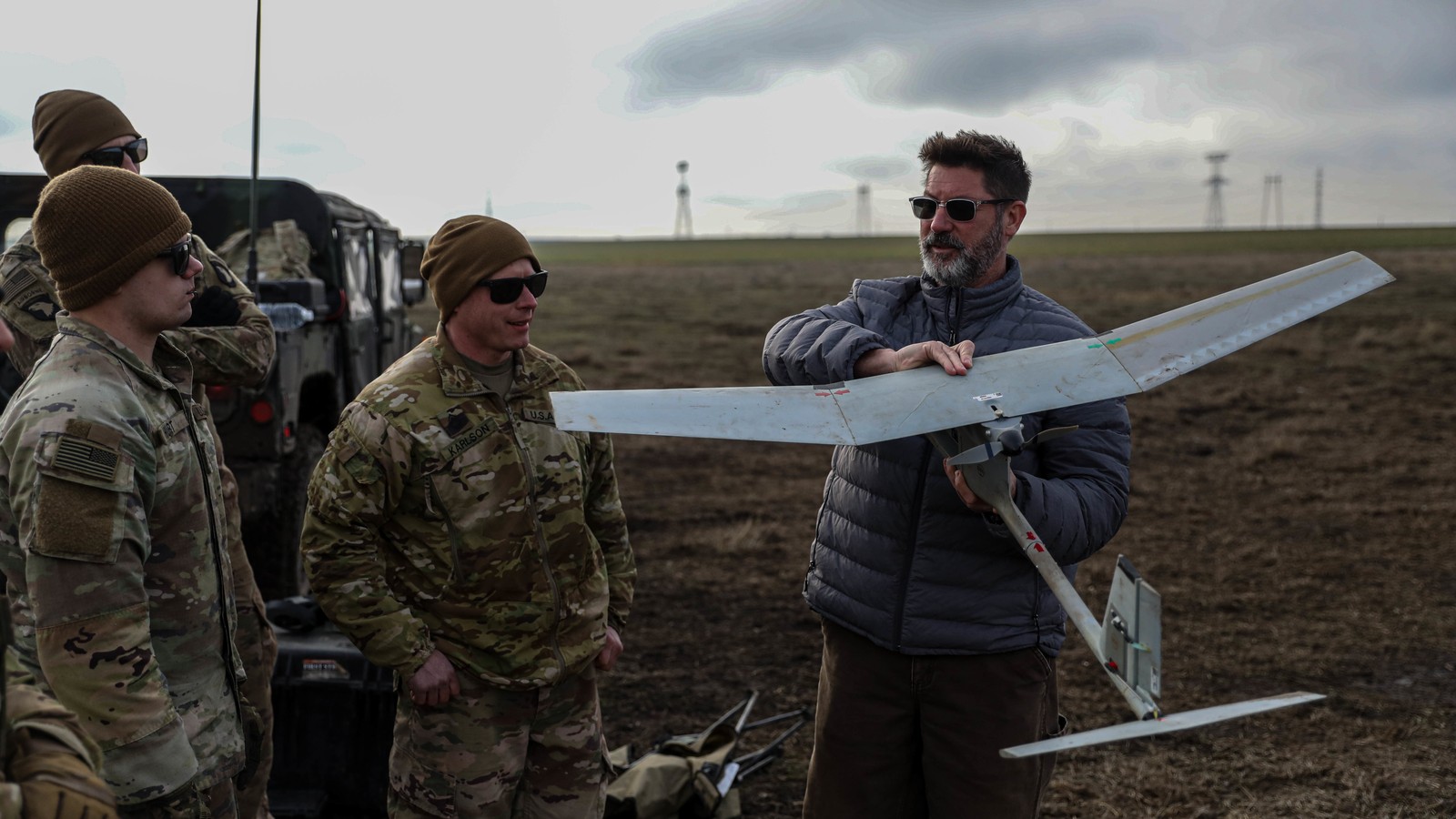 Archival photograph of soldiers learning to operate an AeroVironment Raven drone in Romania; training, not the earnings event.