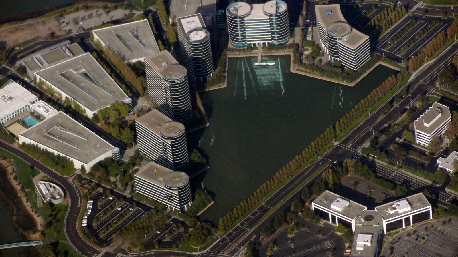 Aerial view of Oracle headquarters beside a lagoon in California