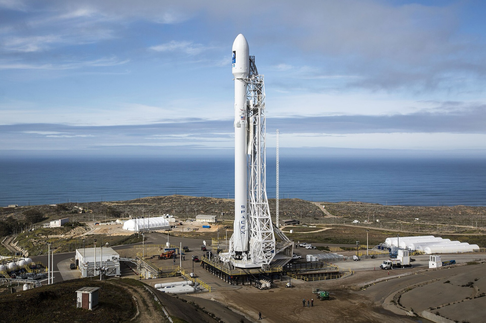 A SpaceX Falcon 9 rocket standing vertical on its launch pad at Vandenberg Air Force Base