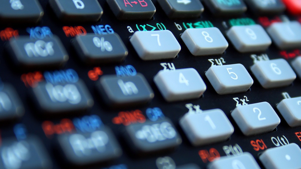 Close-up photograph of gray number keys and colored function labels on a scientific calculator.