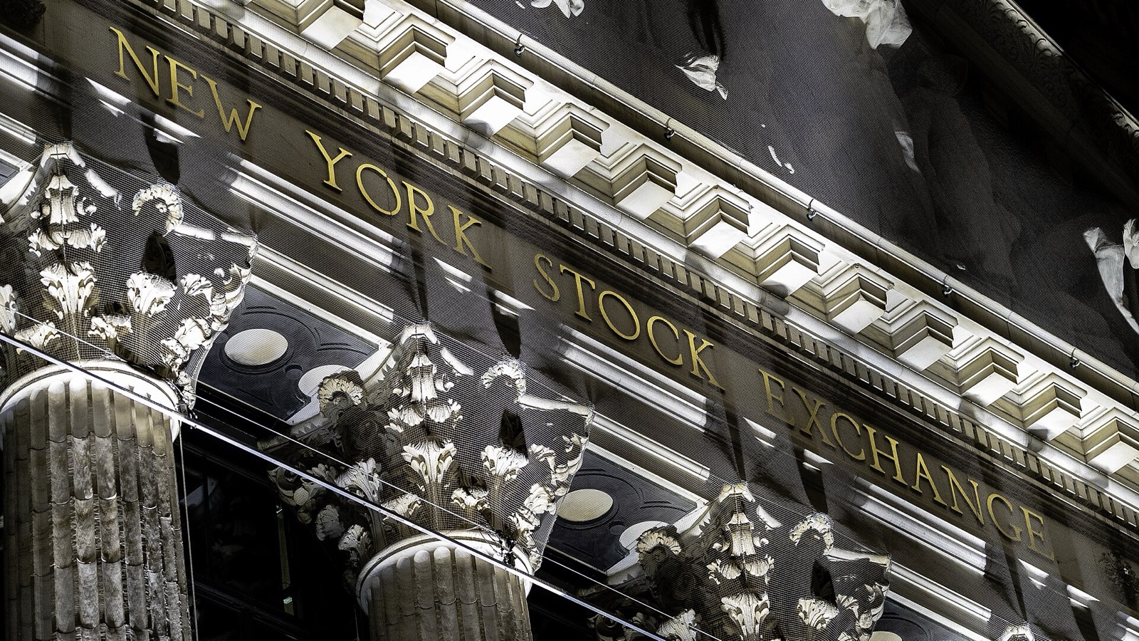 Stone columns and gold lettering on the New York Stock Exchange facade