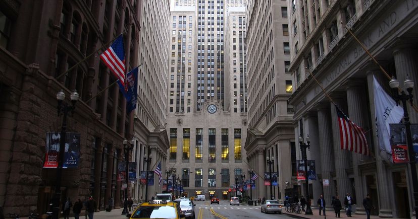 Archival view down LaSalle Street toward the Chicago Board of Trade building, with taxis and pedestrians.