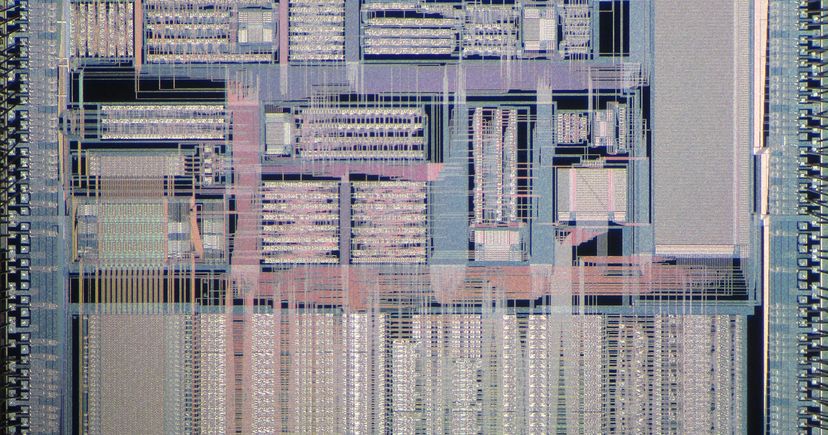 Archival 2017 close-up photograph of a Unisys SCAMP processor die, showing dense metallic circuitry; illustrative semiconductor image, not Cadence hardware.