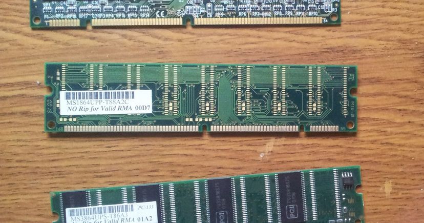 Photograph of SDRAM memory modules on a wooden tabletop; illustrative hardware, not the ETF holdings
